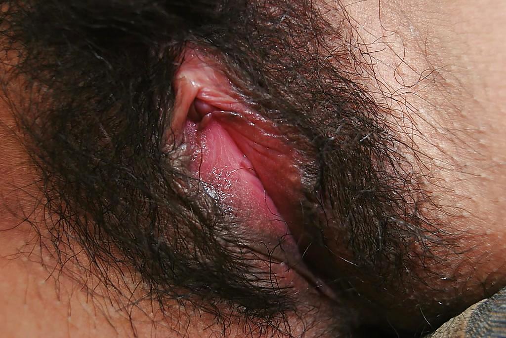 16P Asian chick undressing and exposing her juicy hairy twat in close up