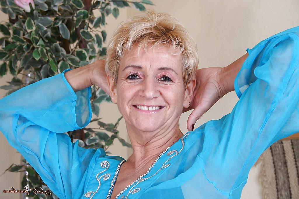 16P Lustful blonde granny stripping and exposing her hairy private parts