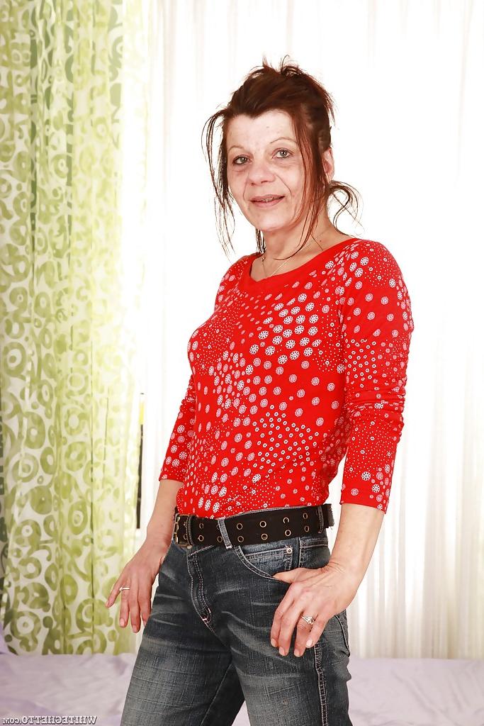 16P Lascivious granny stripping off her clothes and exposing her hairy twat