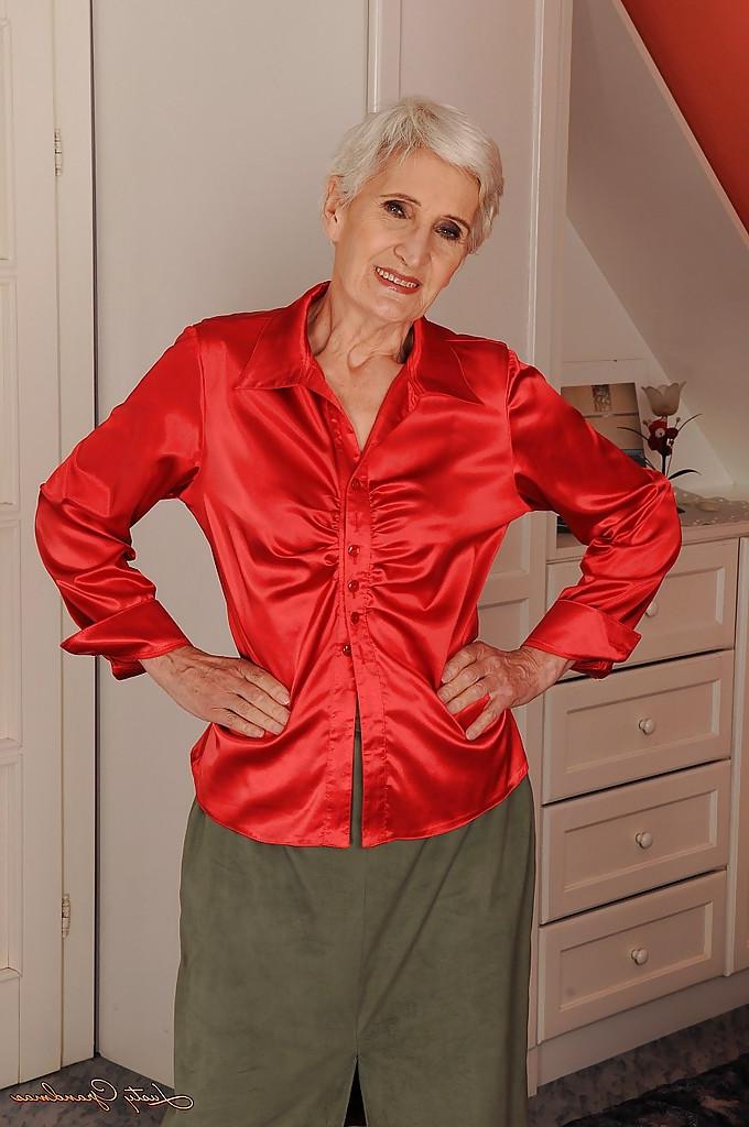 16P Well toned granny in nylon stockings slipping off her clothes