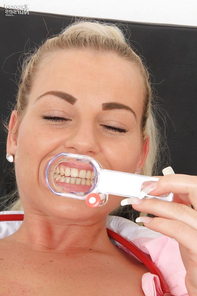 16P Sexy nurse stuffs her cunt with a speculum and exposes it in close up