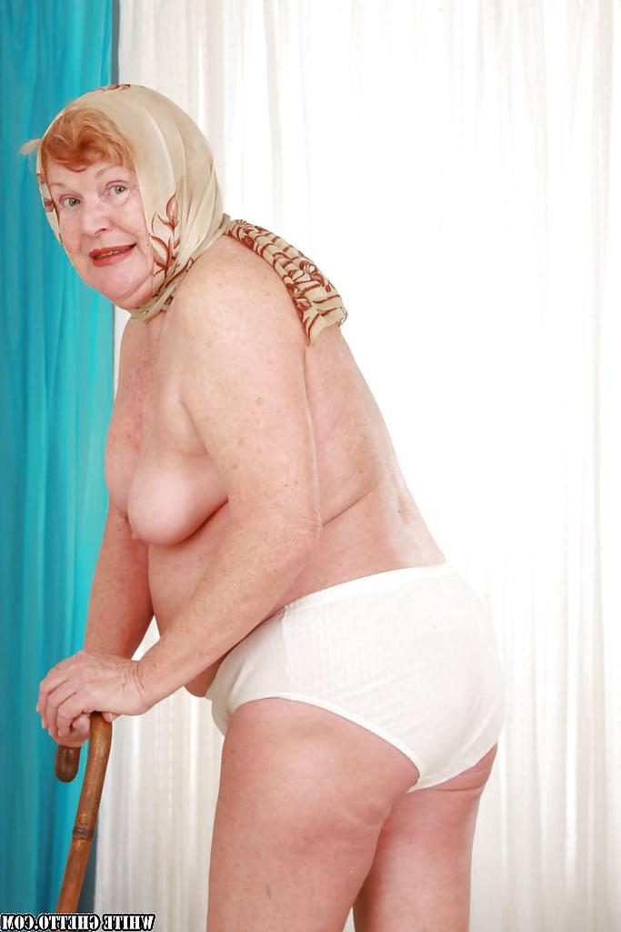 14P Filthy fatty granny with flabby tits stripping and spreading her legs