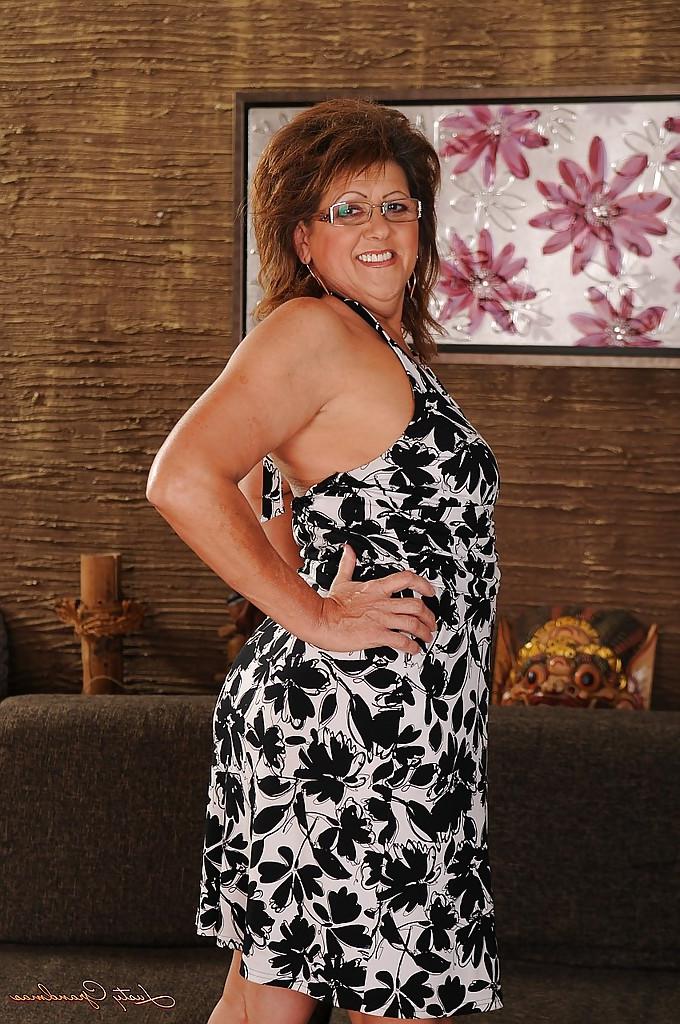 16P Naughty granny in glasses undressing and spreading her legs