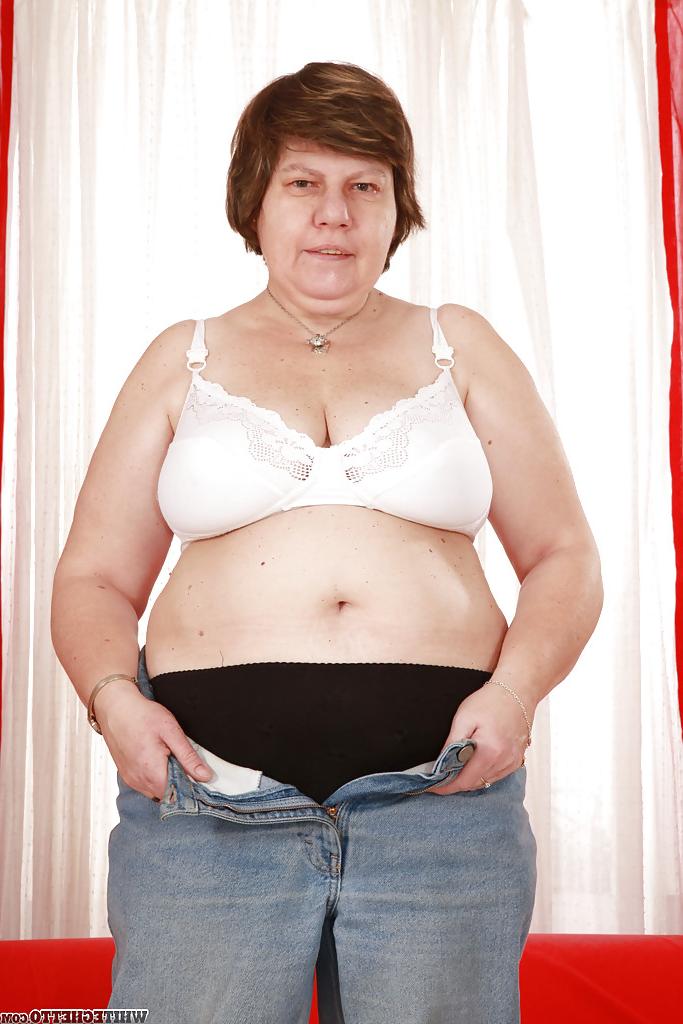 16P Lecherous granny with massive flabby jugs stripping and exposing her twat