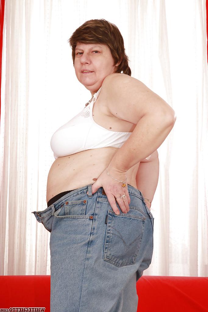 16P Lecherous granny with massive flabby jugs stripping and exposing her twat