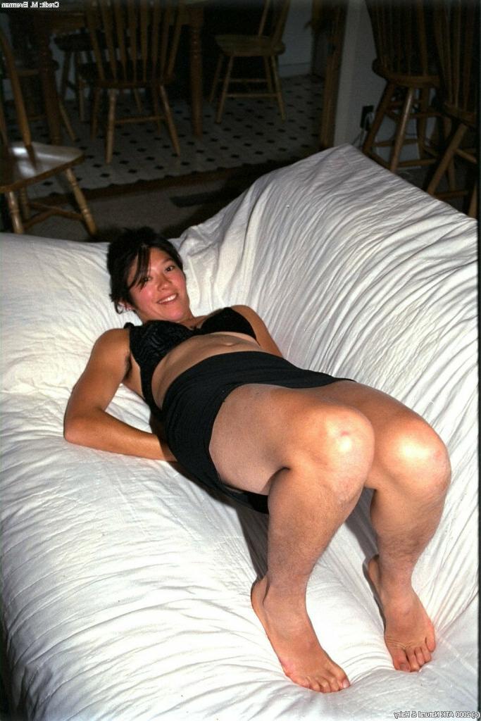 16P Amateur Asian cutie Amanda lies on big couch and spreads her hairy chinchilla