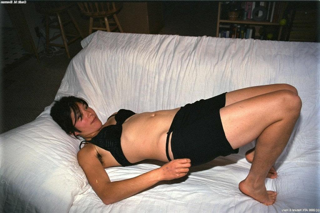 16P Amateur Asian cutie Amanda lies on big couch and spreads her hairy chinchilla