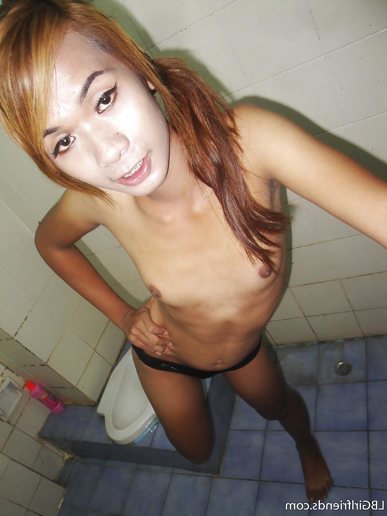 16P Thin Asian ladyboy Nano taking self shots of small tits and hairy dick