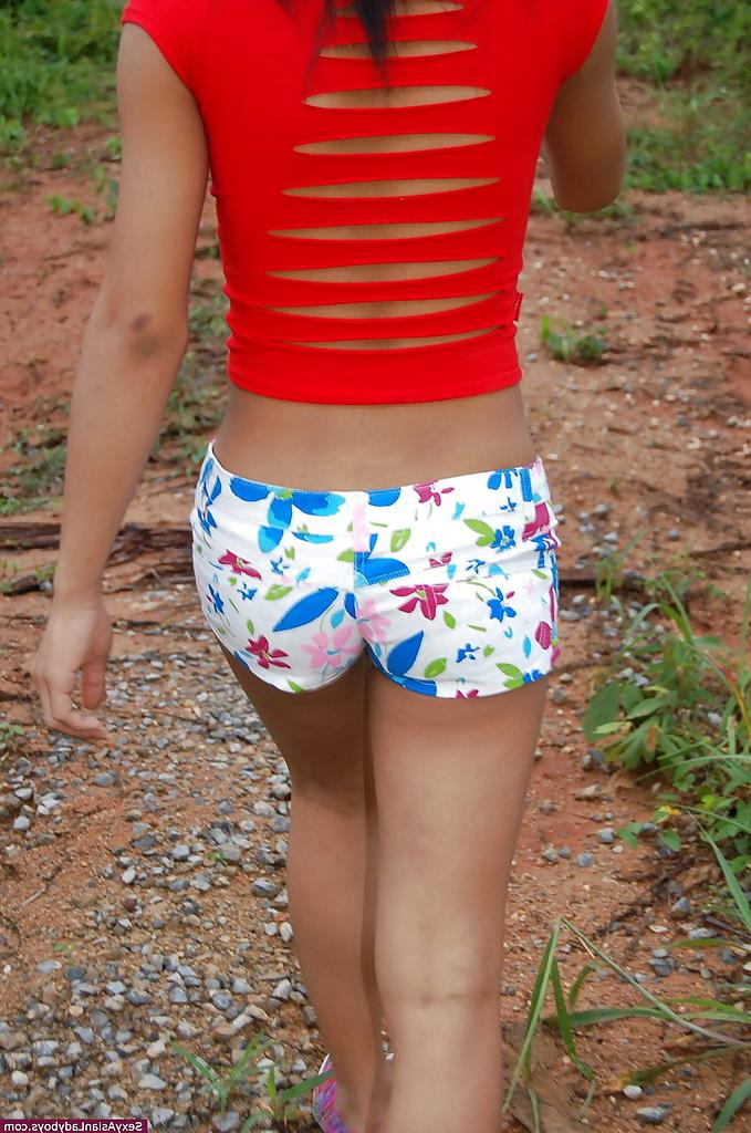 12P Busty young Asian ladyboy getting naked and spreading outdoors