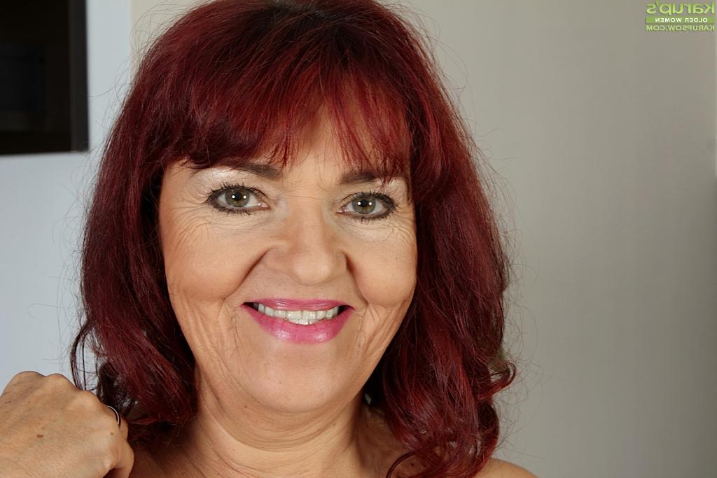 16P Older redhead with saggy breasts spreading shaved vagina in high heels