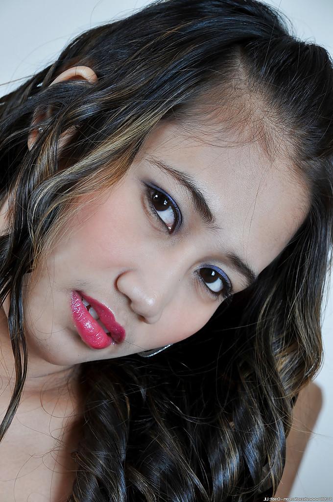 16P Cute Asian girl Akira modeling solo in see thru lingerie and mesh stockings
