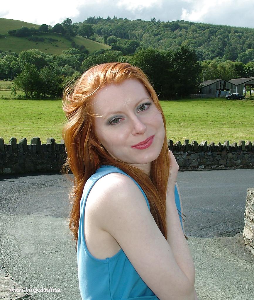 16P Clothed redhead Miranda is revealing her sexy ass in her backyard
