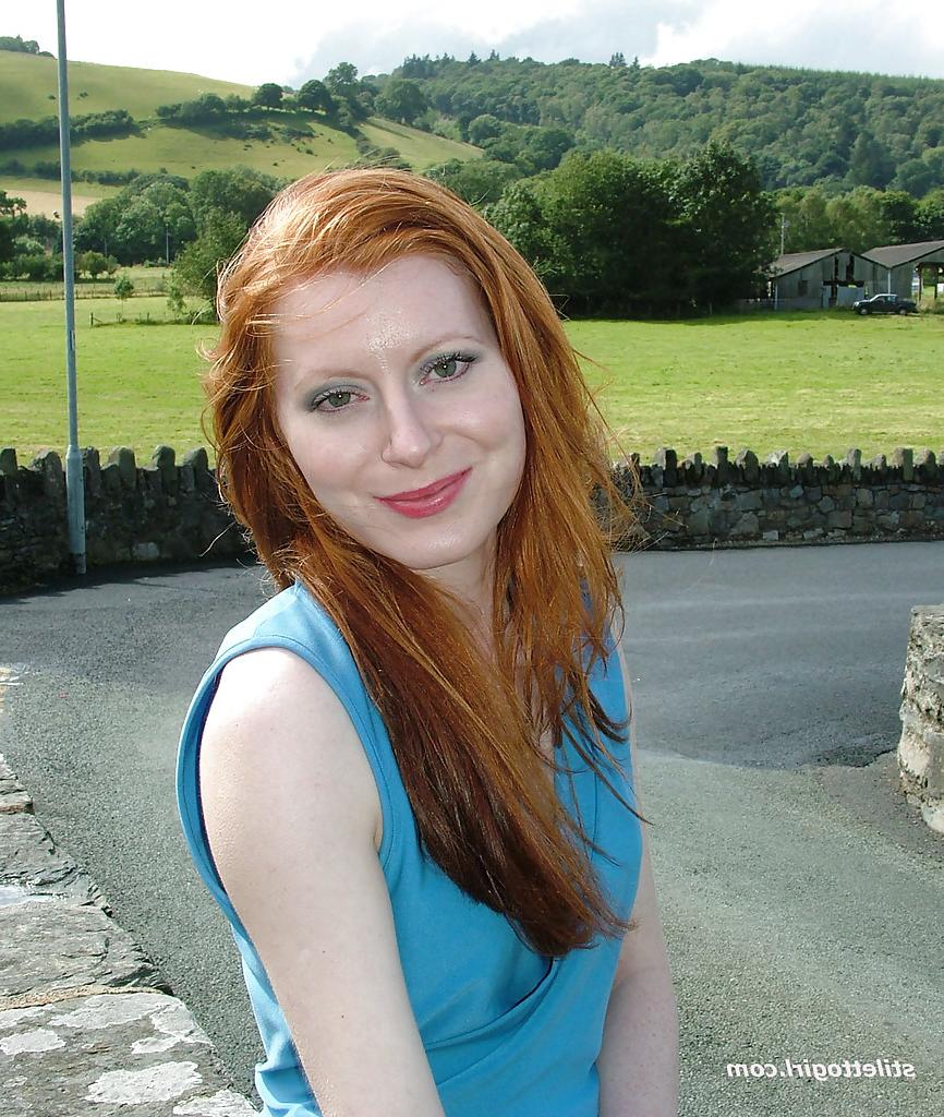 16P Clothed redhead Miranda is revealing her sexy ass in her backyard