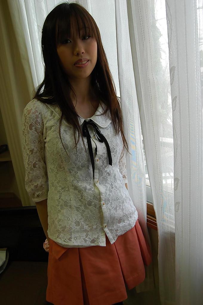 16P Smiley asian girl getting nude and exposing hairy gash in close up