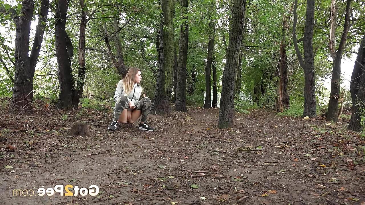 15P Solo girl Barbe pulls down her pants to pee in the forest