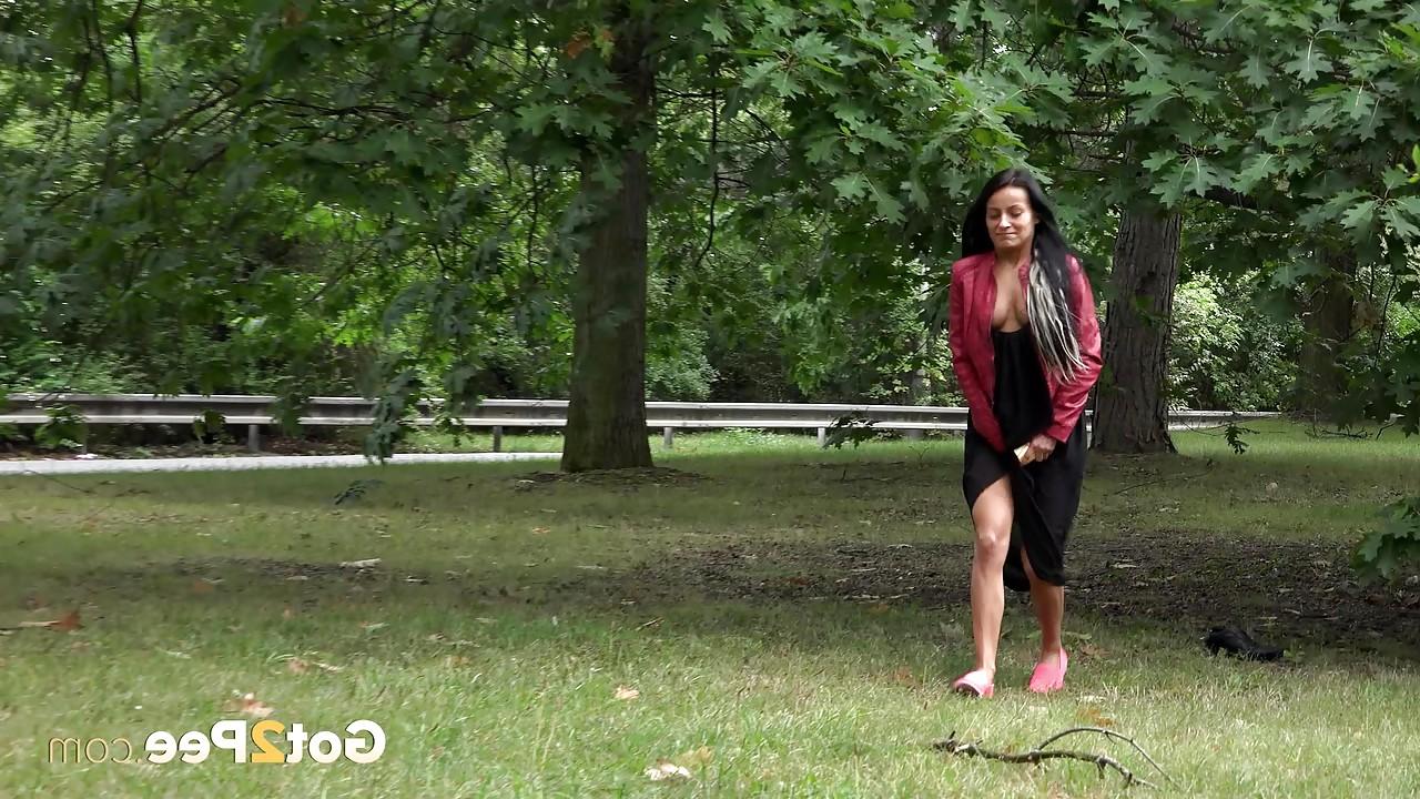15P Dark haired mature Lexi lifting her long skirt and pissing in the park