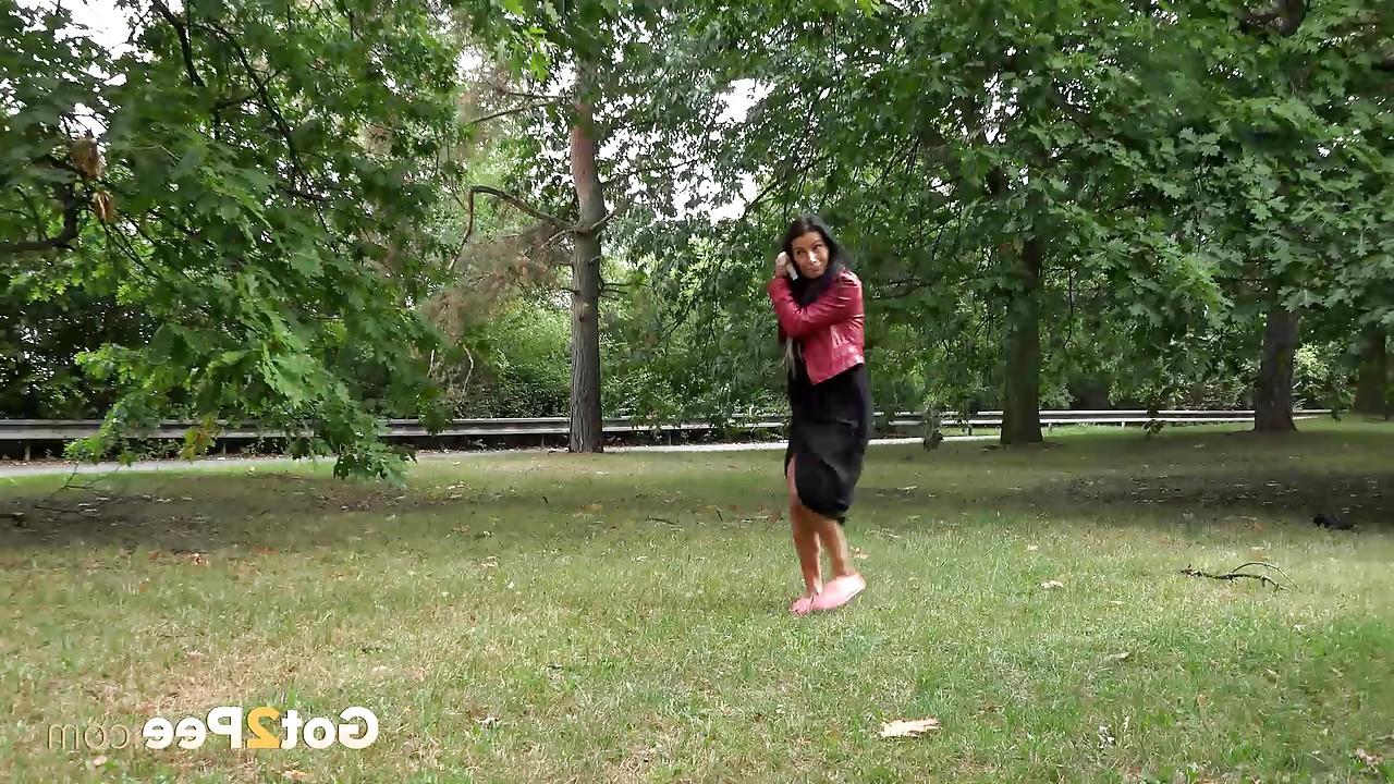 15P Dark haired mature Lexi lifting her long skirt and pissing in the park
