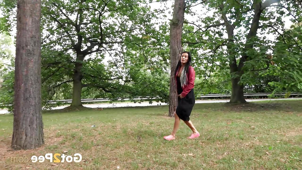 15P Dark haired mature Lexi lifting her long skirt and pissing in the park