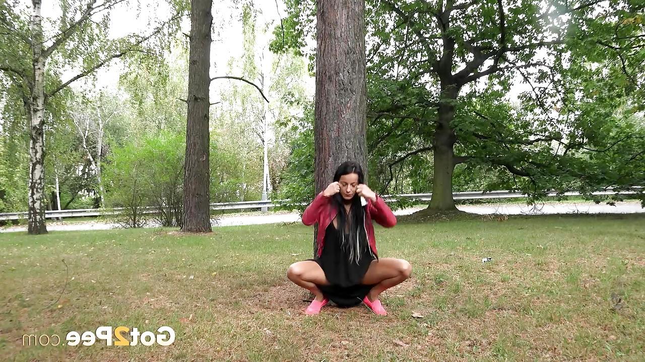 15P Dark haired mature Lexi lifting her long skirt and pissing in the park