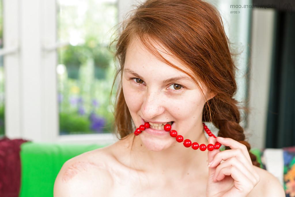 16P Thin redhead Irina undressing for masturbation of hairy amateur pussy