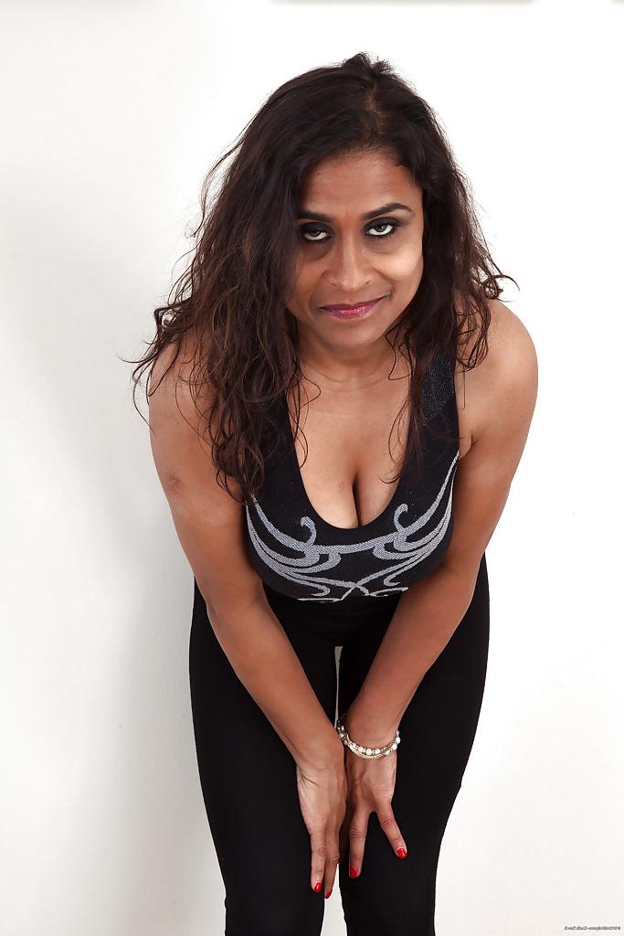 16P Dirty-minded mature lassie undressing and exposing her shaggy twat
