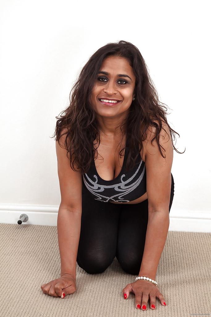 16P Dirty-minded mature lassie undressing and exposing her shaggy twat
