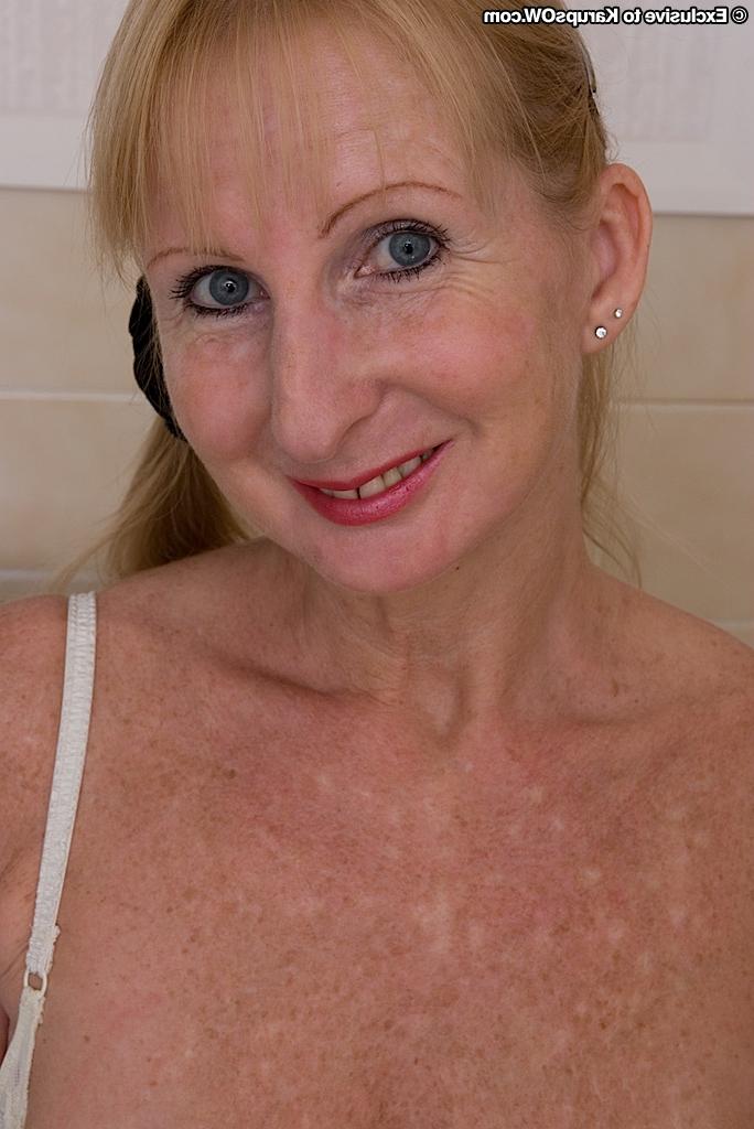 16P Ugly mature blonde in stockings revealing her massive melons and hairy twat