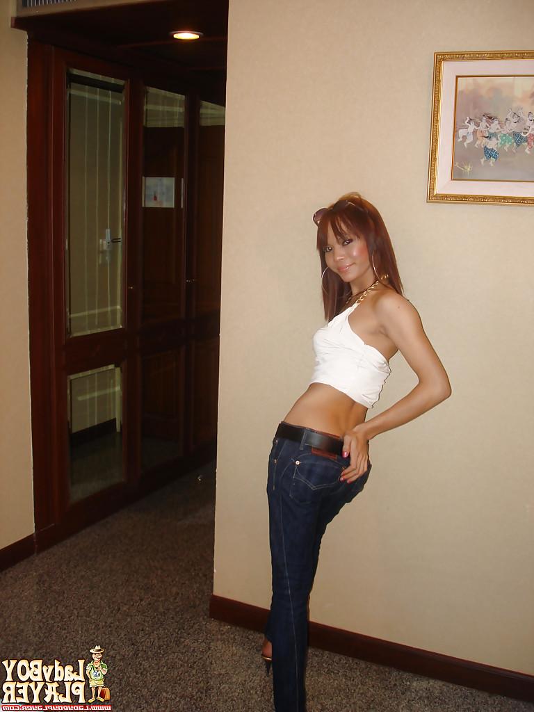 16P Asian ladyboy Pinky masturbating big shaved cock after removing jeans