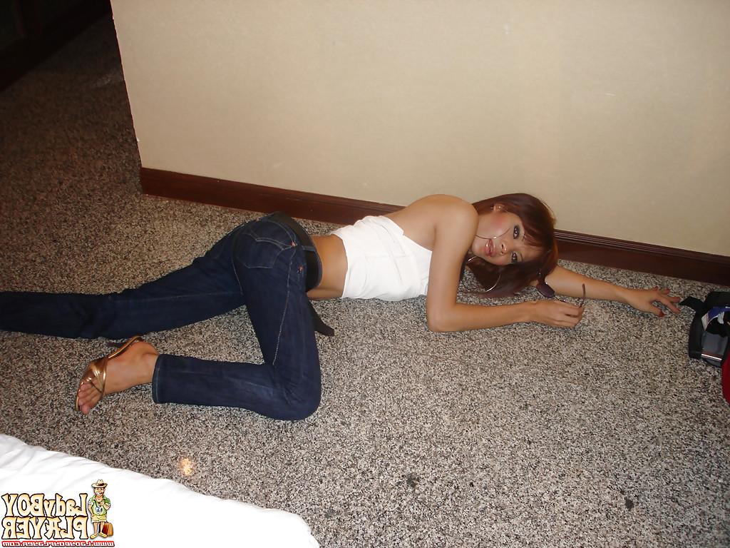 16P Asian ladyboy Pinky masturbating big shaved cock after removing jeans