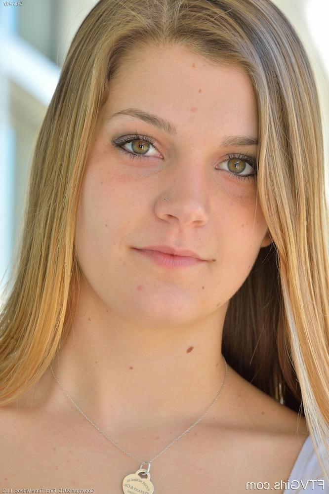 16P Attractive young blonde reveals her tiny tits and her muff outside