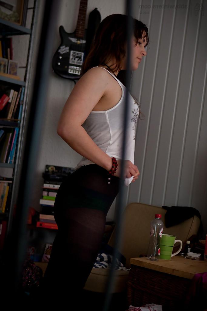16P Naughty voyeur shots of young babe Bea getting dressed after nude modelling