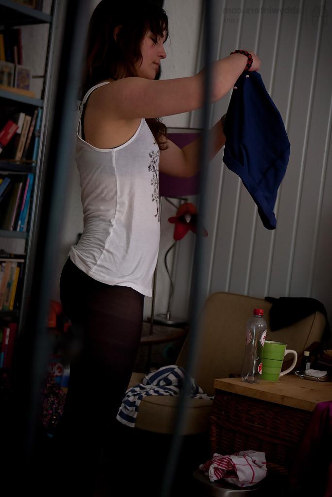 16P Naughty voyeur shots of young babe Bea getting dressed after nude modelling