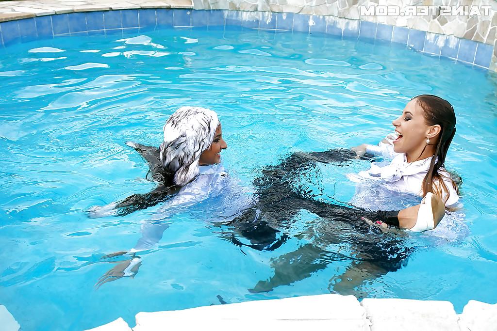 16P Nikky Thorne has some wet fully clothed pool fun with herfriend