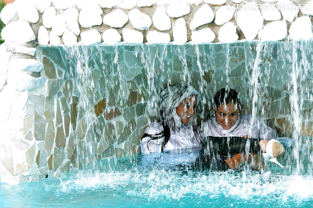 16P Nikky Thorne has some wet fully clothed pool fun with herfriend
