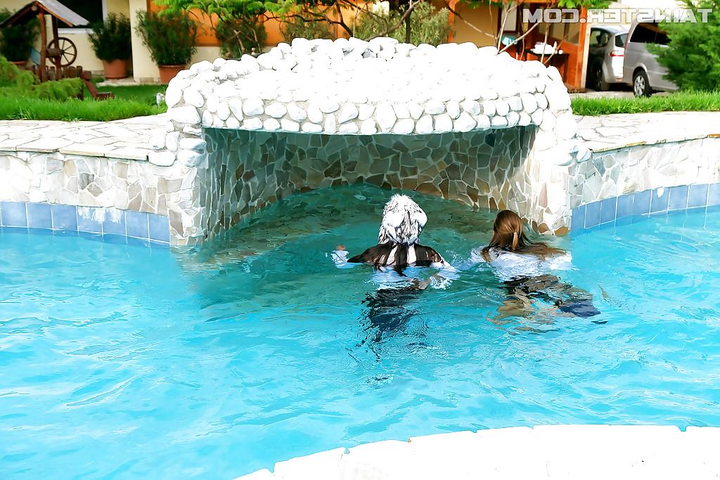 16P Nikky Thorne has some wet fully clothed pool fun with herfriend