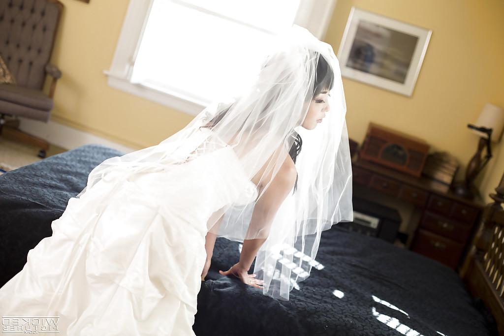 16P Sexy Asian bride Marica Hase removing wedding dress for nude photo spread
