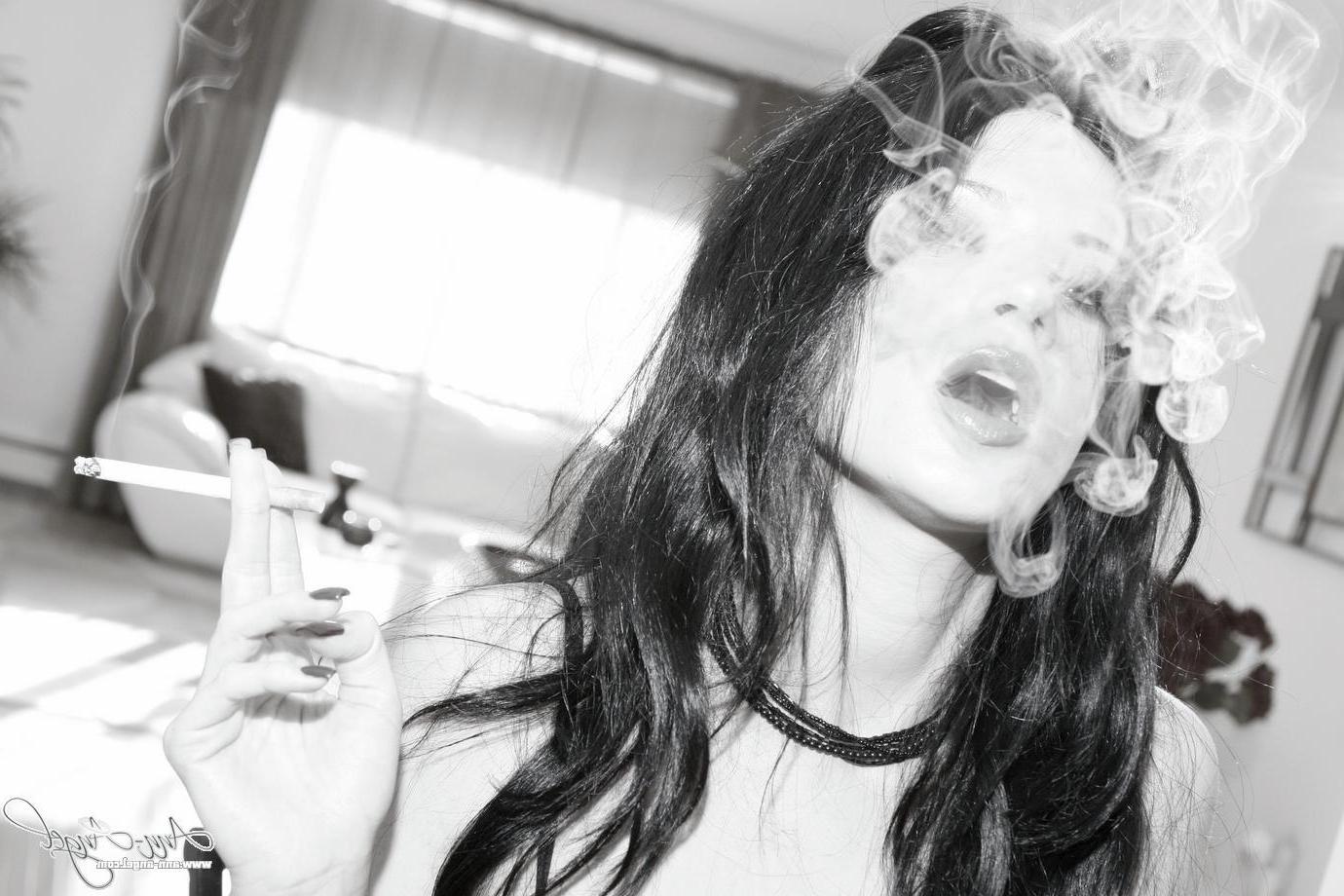 16P Pictures of Ann Angel smoking a cigarette in black lingerie