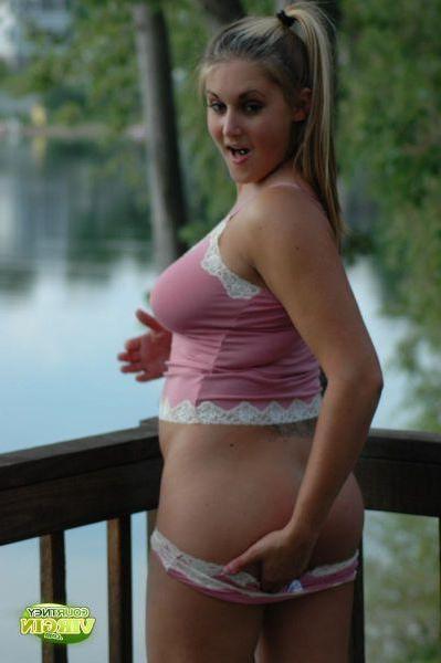 16P Pictures of Courtney Virgin exposing her tits by the water