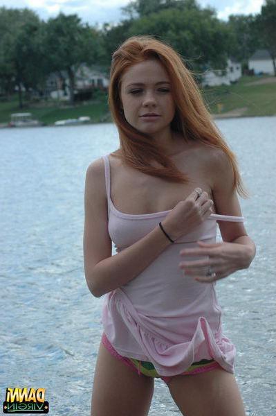 20P Pictures of teen hottie Danni Virgin teasing outside in a white shirt