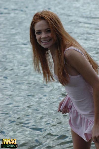 20P Pictures of teen hottie Danni Virgin teasing outside in a white shirt
