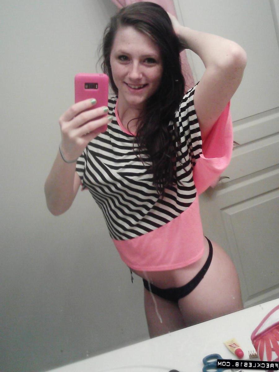 12P Pictures of Freckles 18 taking pics of herself in a black thong