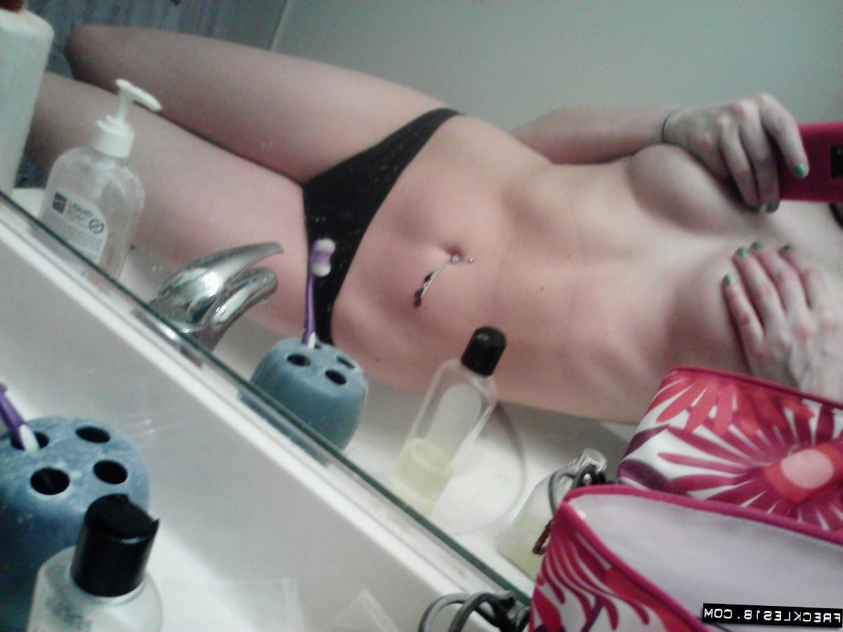 12P Pictures of Freckles 18 taking pics of herself in a black thong
