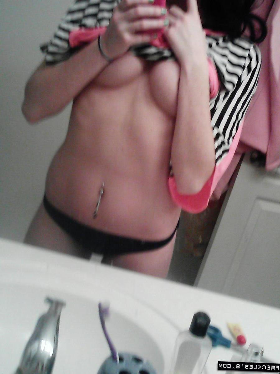 12P Pictures of Freckles 18 taking pics of herself in a black thong