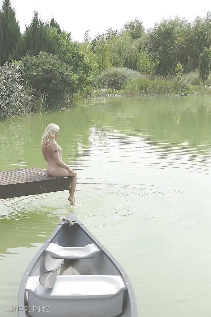 16P Outdoor posing in close up features blonde pornstar Lola Taylor