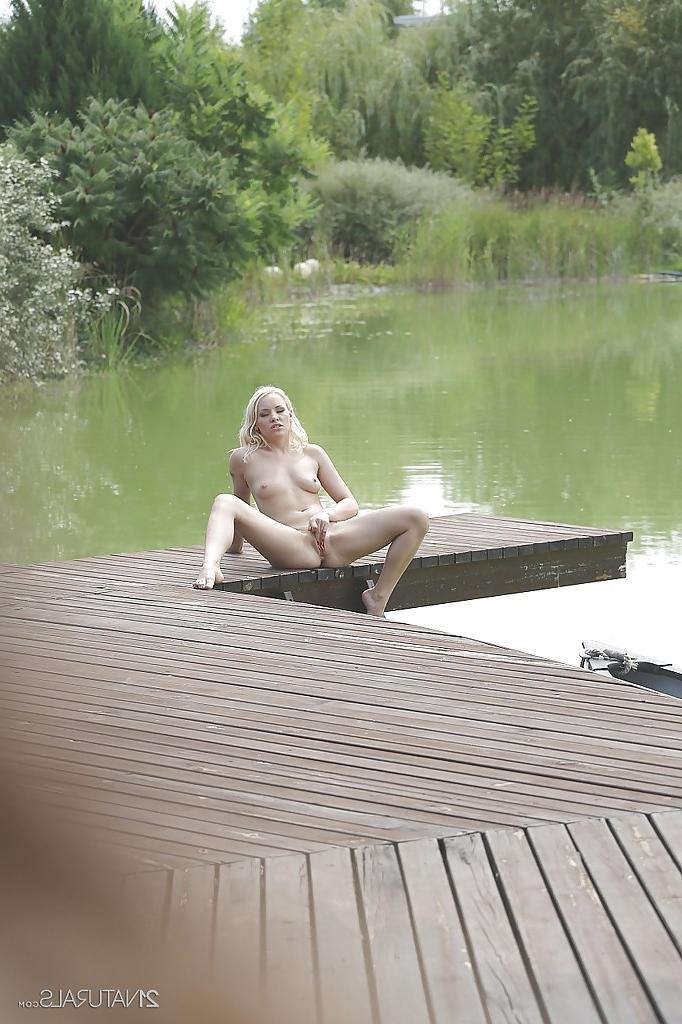 16P Outdoor posing in close up features blonde pornstar Lola Taylor