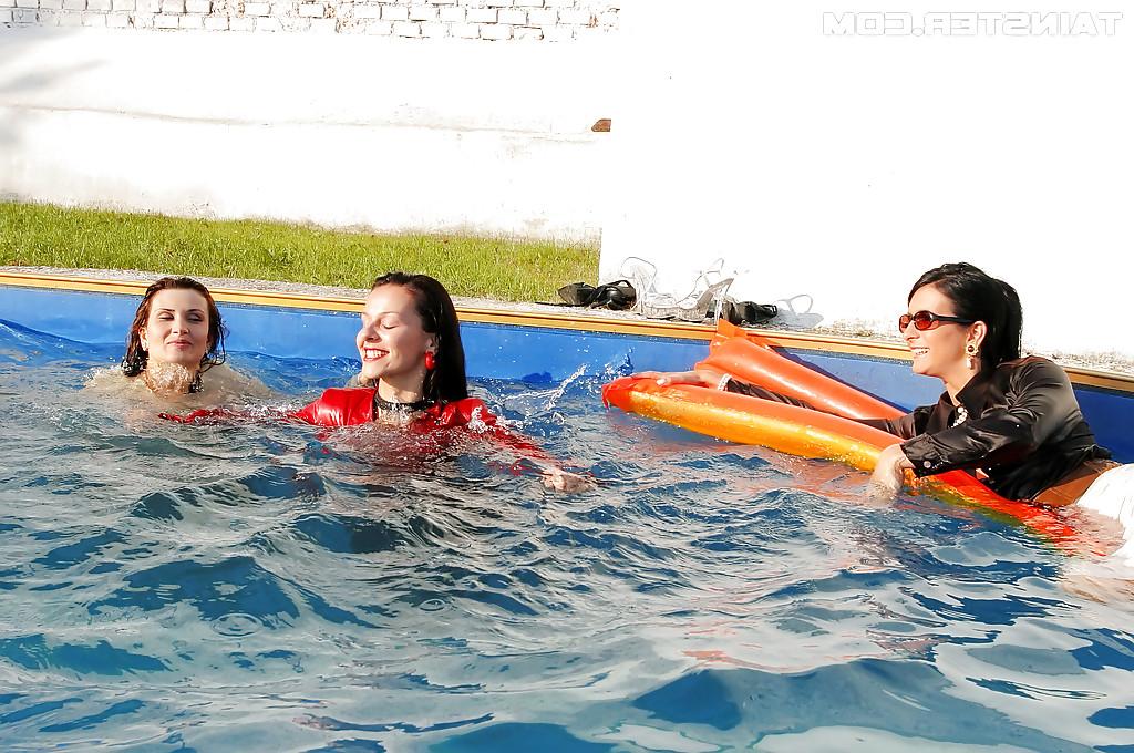 16P Fetish ladies have some wet fully clothed fun with her friends at the poolside