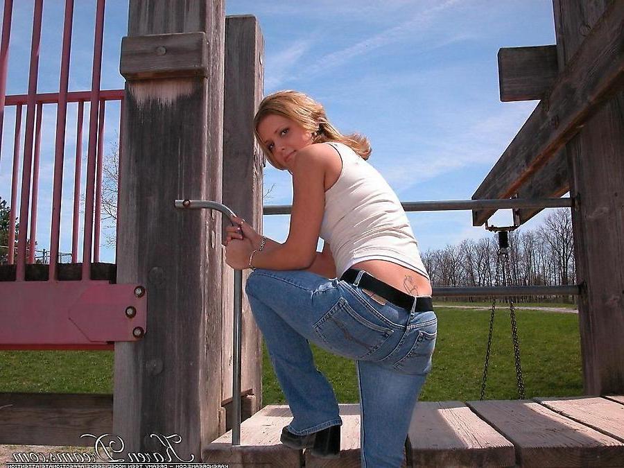 20P Pictures of teen babe Karen Dreams teasing at a park