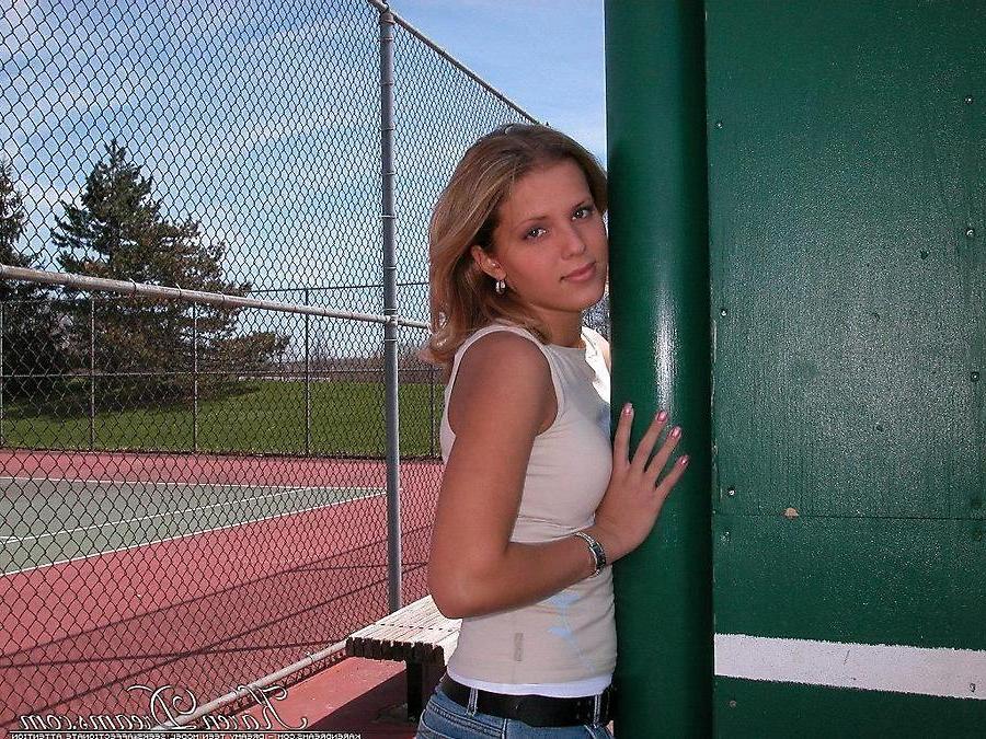 20P Pictures of teen babe Karen Dreams teasing at a park