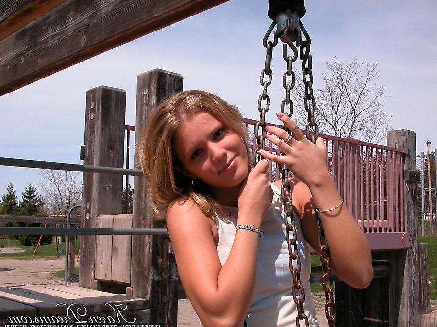 20P Pictures of teen babe Karen Dreams teasing at a park