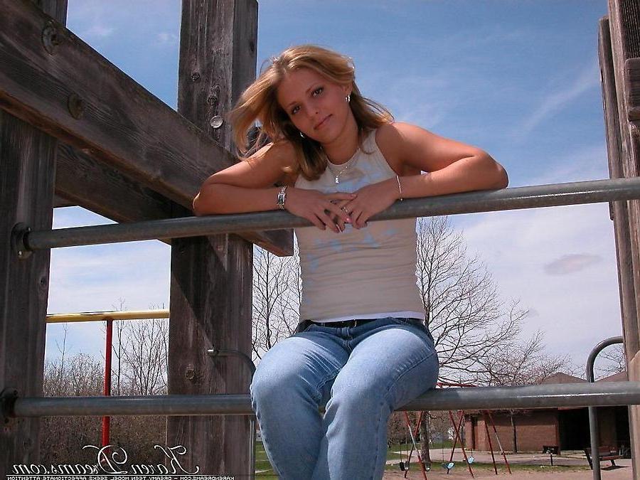 20P Pictures of teen babe Karen Dreams teasing at a park